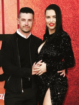 Andre Lemmers with his girlfriend Adriana Lima  showing her baby bump